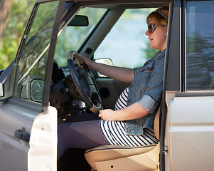 Image showing Pregnant woman at the wheel of car