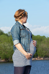 Image showing Pregnant woman on the river coast