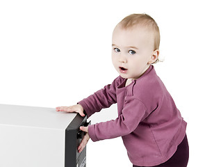 Image showing young child playing with CD