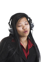 Image showing woman listening to music over white background