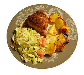 Image showing Freshly baked potatoes and chicken with salad 