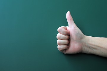 Image showing Thumb up on a blackboard background