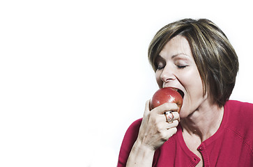 Image showing woman eating and apple