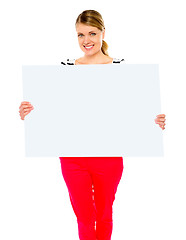 Image showing Pretty lady displaying blank placard