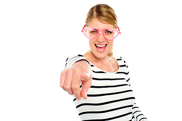 Image showing Excited woman pointing at you