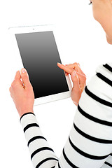 Image showing Cropped image of smiling woman using tablet pc