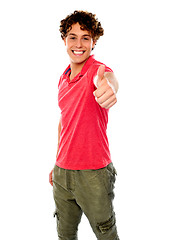 Image showing Smart guy standing with thumbs-up