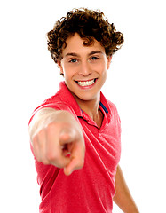 Image showing Handsome curly hair teen pointing at you