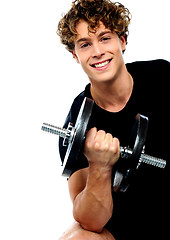 Image showing Athlete doing exercise with dumbbell