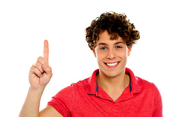 Image showing Casual guy indicating upwards