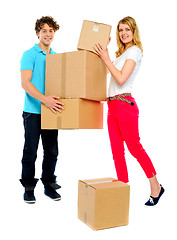 Image showing Lovely couple holding cardboard boxes