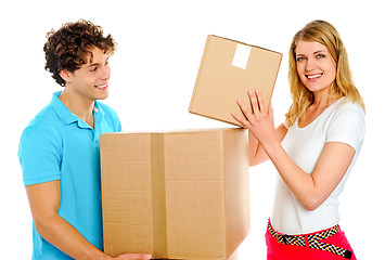 Image showing Couple arranging cardboard boxes