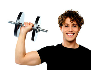 Image showing Powerful muscular young man lifting weight