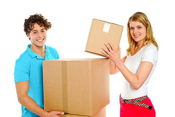 Image showing Attractive caucasian couple holding cardboard boxes