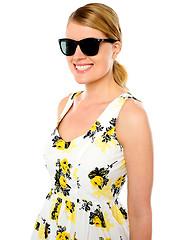 Image showing Smiling young woman wearing sunglasses