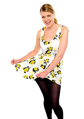 Image showing Happy trendy girl showing her new dress