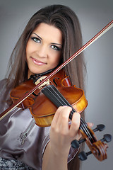 Image showing beautiful girl playing violin