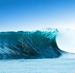 Image showing Large surfing wave breaks in the ocean