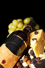 Image showing red wine bottle with grape and cheese