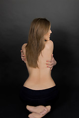 Image showing Classic low-key photo of sexy woman on back