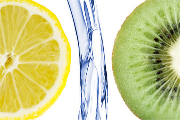 Image showing sliced lime with lemon splashing in water isolated