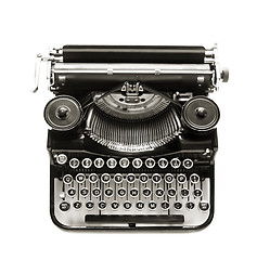 Image showing Antique typewriter a white backdrop.