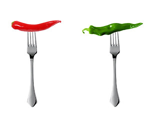 Image showing Red hot chili pepper with green pepper pricked on forks
