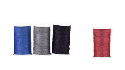 Image showing Colourful spools of thread isolated on white background