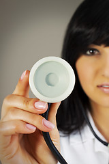 Image showing Close up - hand of a doctor holding stethoscope