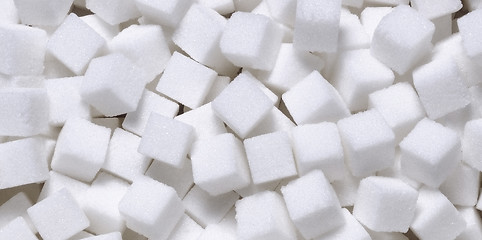 Image showing white sugar in cubes texture background