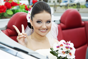 Image showing Portrait of the bride sitting in the car