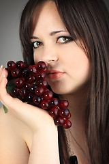 Image showing young woman with grape