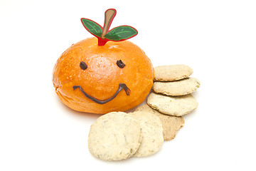 Image showing Smiley face on bread and biscuits on white background