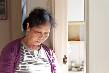 Image showing A 50s asian woman at home taking rest