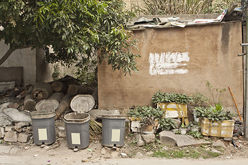 Image showing Chinese village with houses and rubbish bins