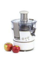 Image showing Electrical juicing machine and two apples