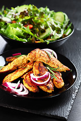 Image showing Marinated chicken breast stripes with salad