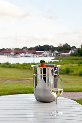 Image showing Ice bucket with champagne and glass