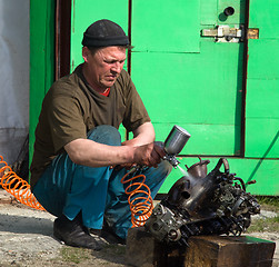 Image showing Locksmith washes the car engine before disassembly