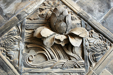 Image showing Ancient brick carving art of lotus