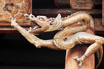 Image showing Ancient wood carving art of dragon