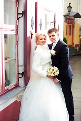 Image showing beautiful groom and the bride on the street of old town