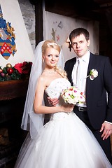 Image showing beautiful groom and bride in interior