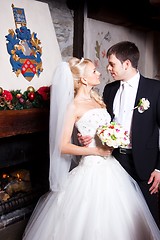 Image showing beautiful groom and bride in interior