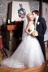 Image showing beautiful groom and bride in interior