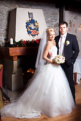 Image showing beautiful groom and bride in interior