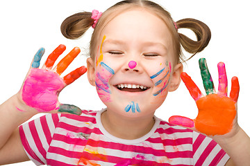 Image showing Portrait of a cheerful girl with painted hands