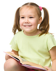 Image showing Cute little girl with book