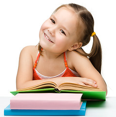 Image showing Cute little girl with books