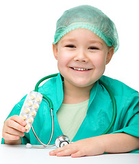 Image showing Cute little girl is playing doctor